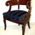 A Neoclassical barrel back armchair