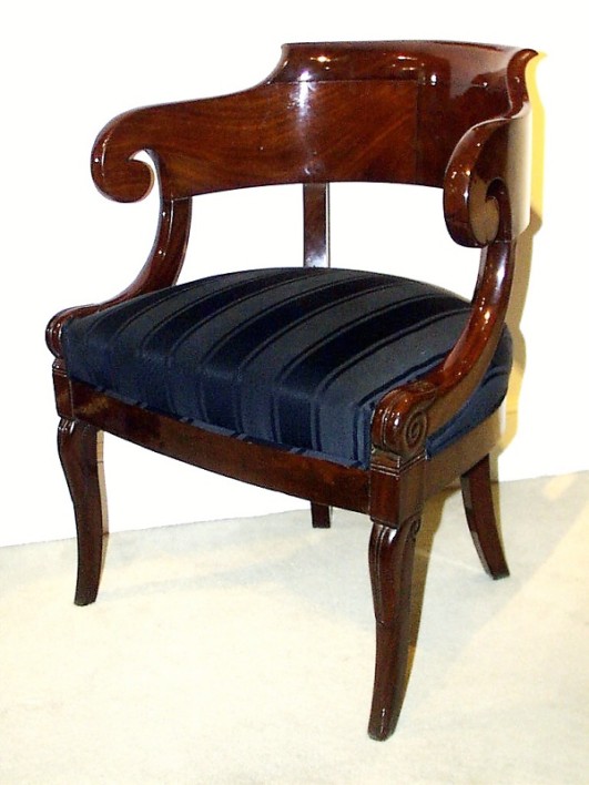 A Neoclassical barrel back armchair