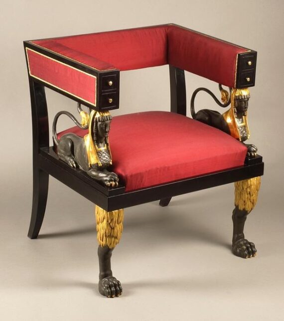 An exceptional rare Empire armchair with four drawers in the armrests