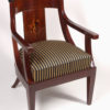 A Biedermeier barrel-back armchair