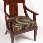 A Biedermeier barrel-back armchair