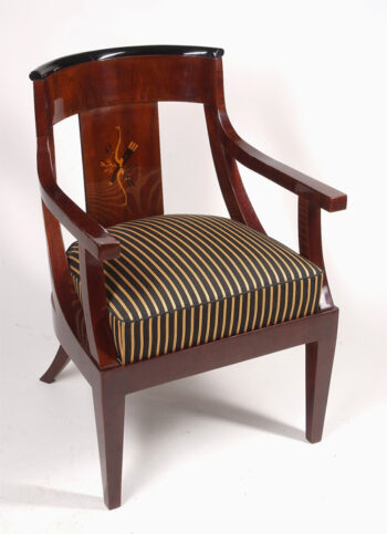 A Biedermeier barrel-back armchair