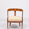 A petite Biedermeier open armchair