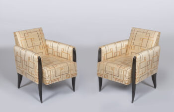 A pair of elegant French 1940's ebonized fauteuils