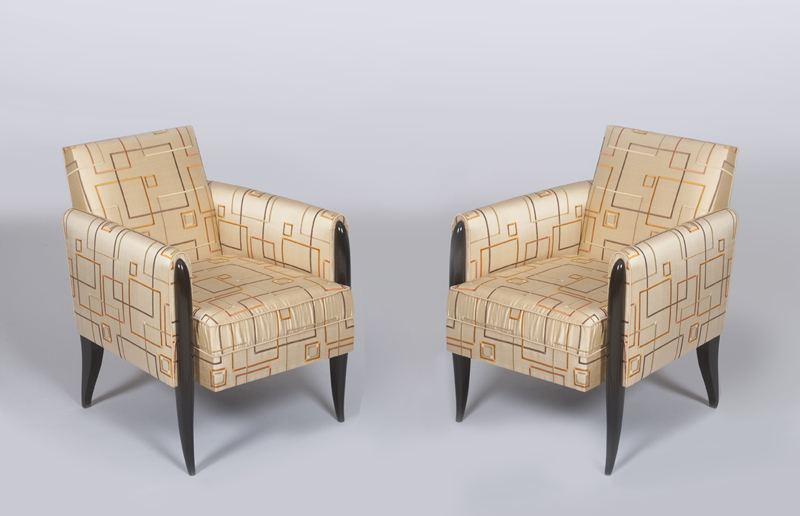 A pair of elegant French 1940's ebonized fauteuils