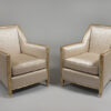 A pair of sculpted and gilt Art Deco armchairs