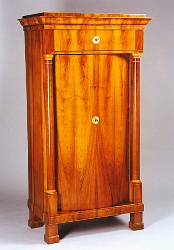 A Biedermeier convex front single door armoire