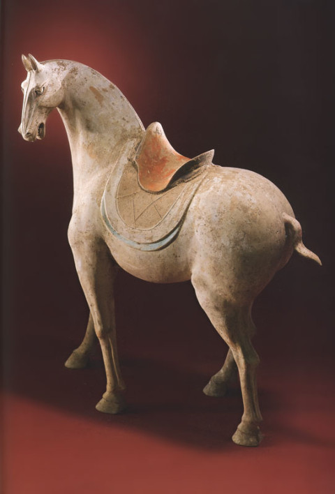 A massive pottery figure of a saddled horse