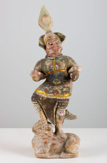 Pottery figure of a small Lokapala in full armor astride a bull