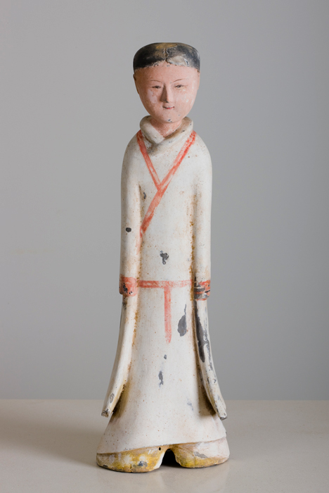 A finely painted standing pottery figure of female attendant