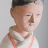 A finely painted standing pottery figure of female attendant