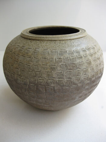 Large ash glazed jar with overall comb motif