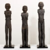 A set of three pottery standing figures