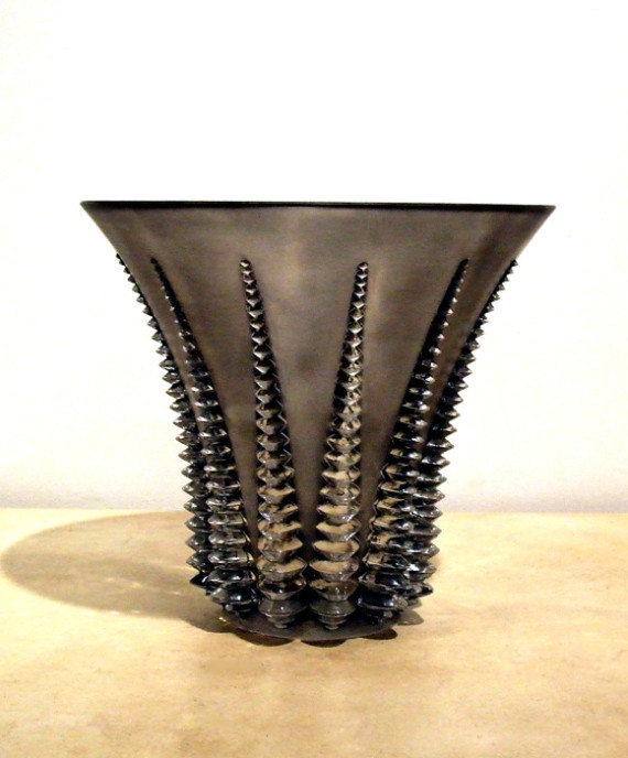 A striking geometric bell shaped vase by