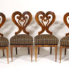A rare and unusual set of four Biedermeier sidechairs with heart-shaped back