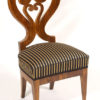 A rare and unusual set of four Biedermeier sidechairs with heart-shaped back