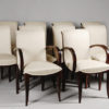 A set of ten dining chairs in rosewood after Jules Leleu