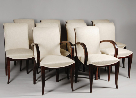 A set of ten dining chairs in rosewood after Jules Leleu