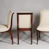 A set of ten dining chairs in rosewood after Jules Leleu