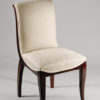 A set of ten dining chairs in rosewood after Jules Leleu