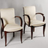 A set of ten dining chairs in rosewood after Jules Leleu