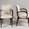 A set of ten dining chairs in rosewood after Jules Leleu