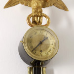 An unusual Empire wall clock