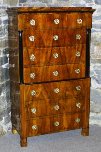 A Biedermeier seven drawer tall chest of drawers