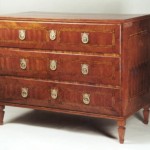 A Neoclassical three drawer commode