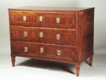 A Neoclassical three drawer commode