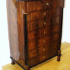 A Biedermeier seven drawer tall chest