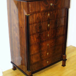 A Biedermeier seven drawer tall chest