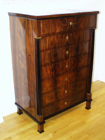 A Biedermeier seven drawer tall chest