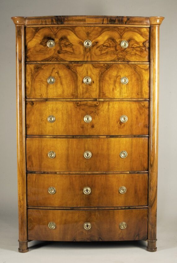 A Biedermeier six drawer tall chest of drawers