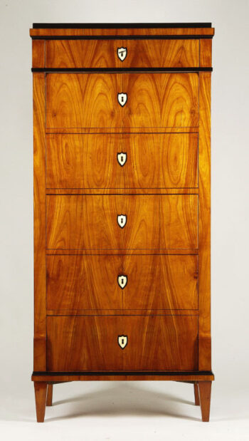 An elegant Biedermeier six-drawer tall chest of drawers