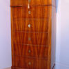 A Biedermeier six drawer tall chest