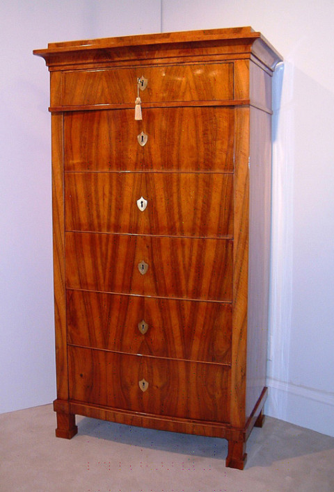 A Biedermeier six drawer tall chest