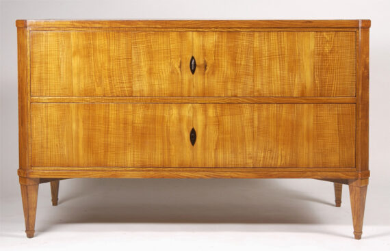 An elegant Neoclassical two drawer commode