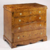 A petite Biedermeier four-drawer commode