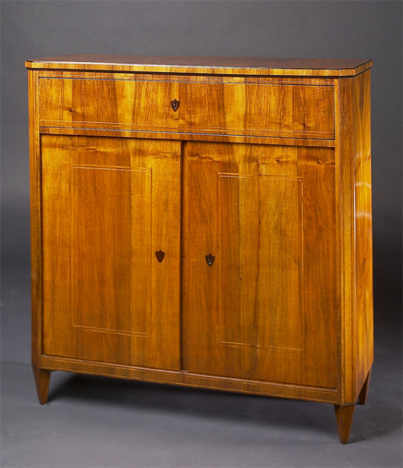 A Biedermeier trumeau commode