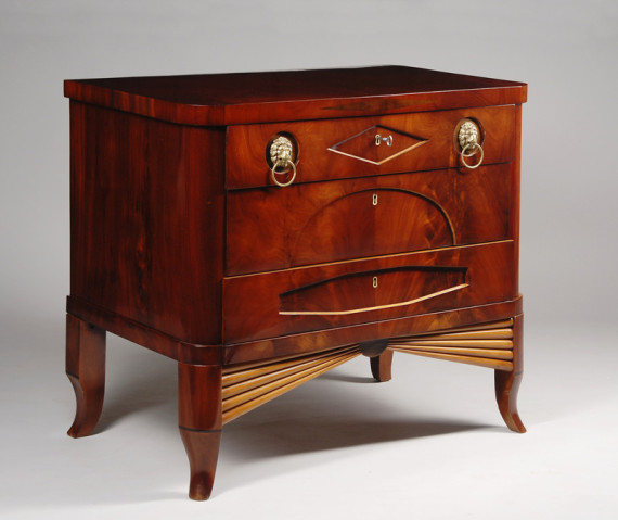 A petite Biedermeier three drawer commode