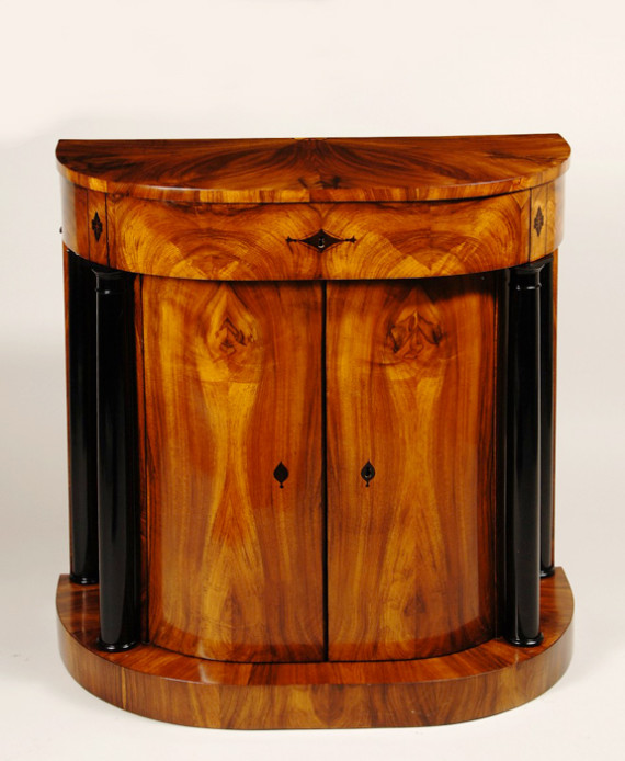 An exceptional Biedermeier demi-lune commode