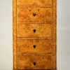 A tall Biedermeier five-drawer chest