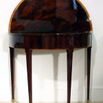 An unusual Neo-classical demi-lune console/game table