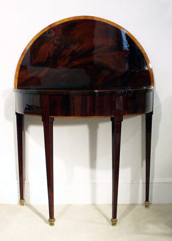 An unusual Neo-classical demi-lune console/game table