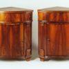 A pair of Neoclassical corner console tables