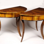 A pair of Biedermeier demi-lune console tables
