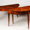 A pair of Biedermeier demi-lune console tables