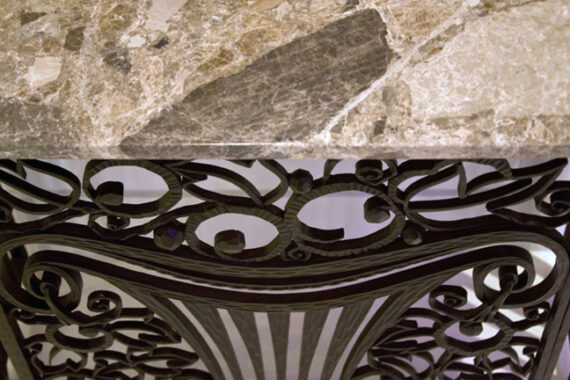 A pair of exceptional Art Deco iron console enclosures