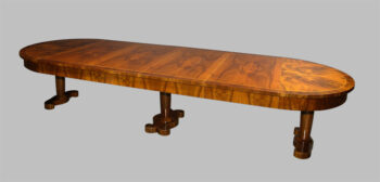 A Biedermeier double pedestal extendable dining table